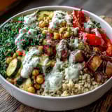 Colorful roasted sweet peppers, steamed kale, and chickpeas fill this wholesome Mediterranean Buddha Bowl meal prep lunch.