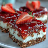 Delicious layered strawberry pretzel salad dessert bars, a perfect summer treat.